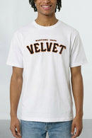 Person wearing a white t-shirt with 'Martinez Napa Velvet' text on a plain background
