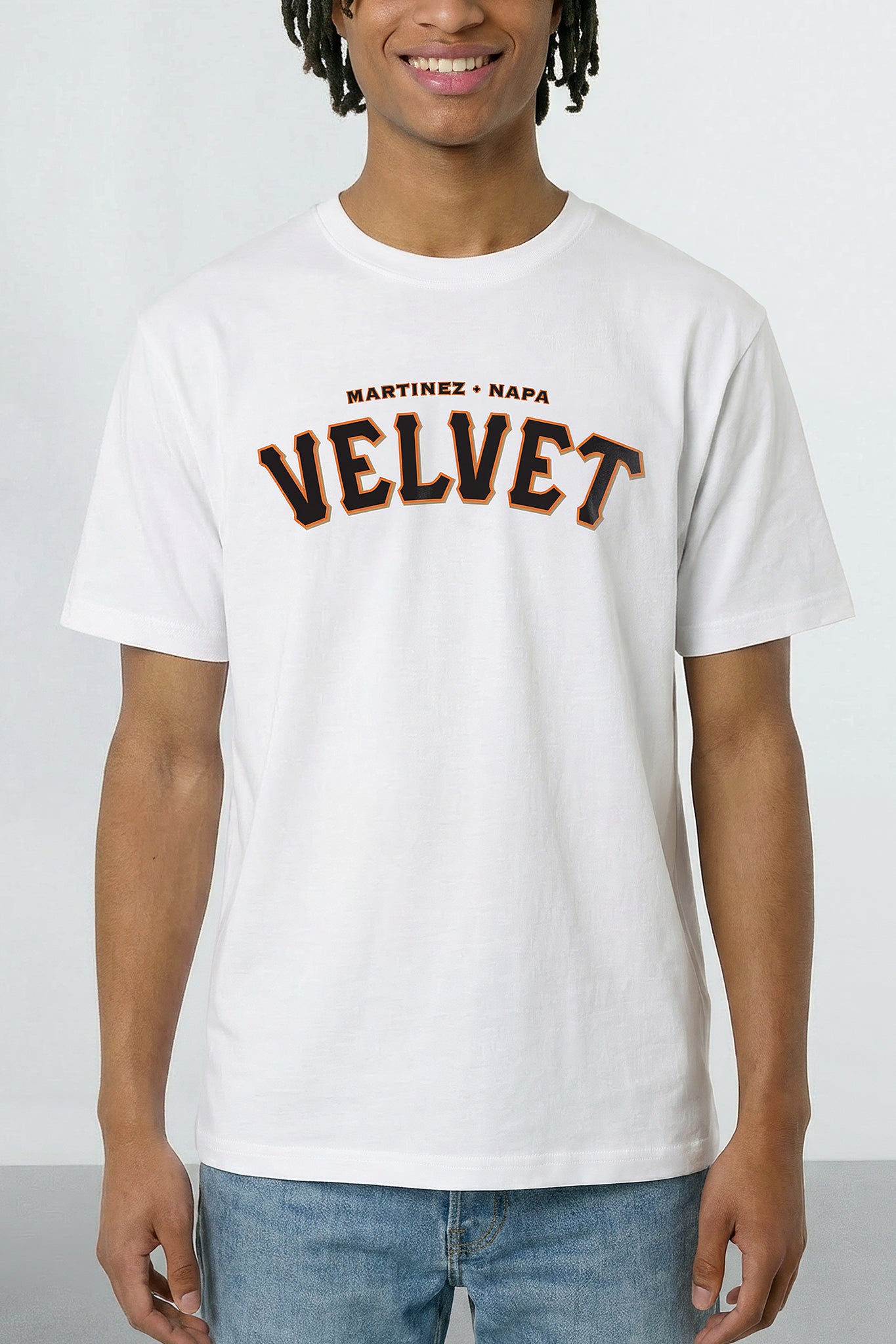 Person wearing a white t-shirt with 'Martinez Napa Velvet' text on a plain background