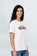 Woman wearing a white t-shirt with brown text on a light background