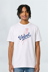 Person wearing a white t-shirt with 'Velvet' logo on a plain background