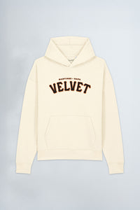 Cream hoodie with 'Velvet' text on a light gray background